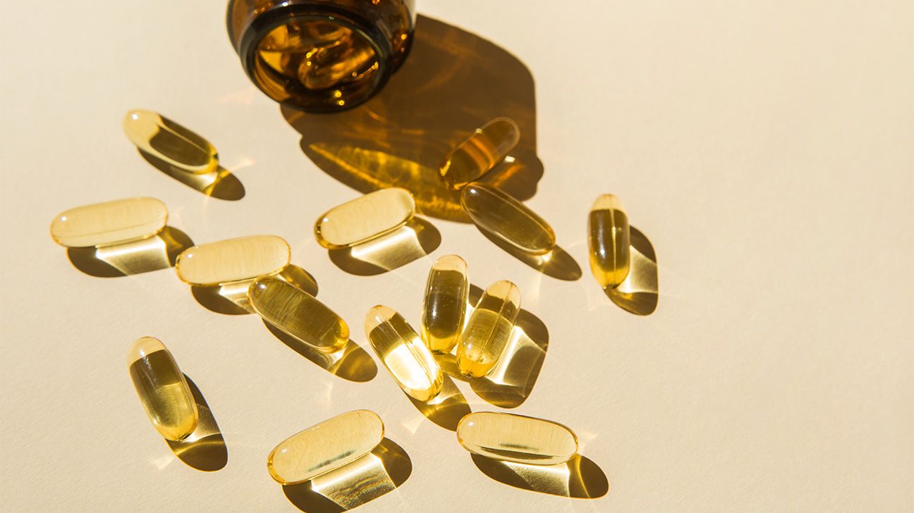 Omega-3 capsules spilled out on a table