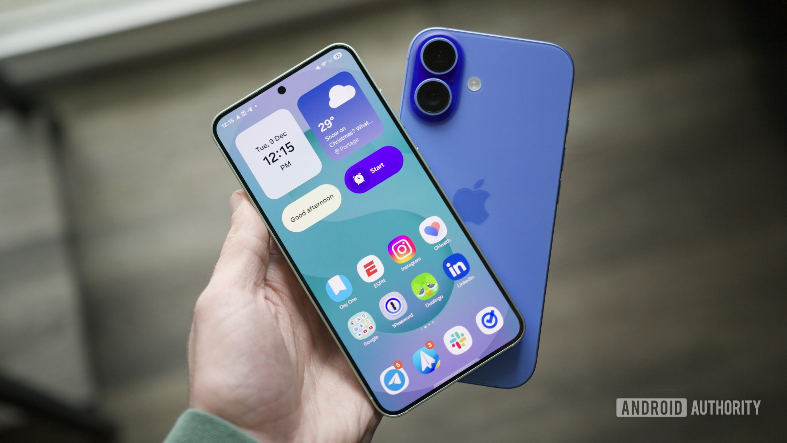 samsung galaxy s25 iphone 16 hero Someone holding a Galaxy S25 and an iPhone.