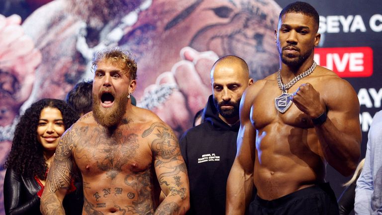 Jake Paul and Anthony Joshua at the weigh-in. Pic: Reuters