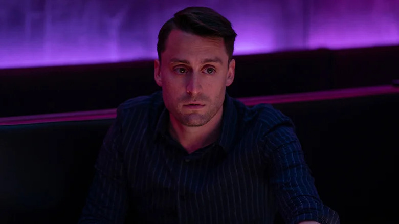 Roman Roy (Kieran Culkin) sits in a club on Succession