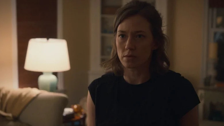 Nora Dunne (Carrie Coon) stands solemnly in a living room on The Leftovers