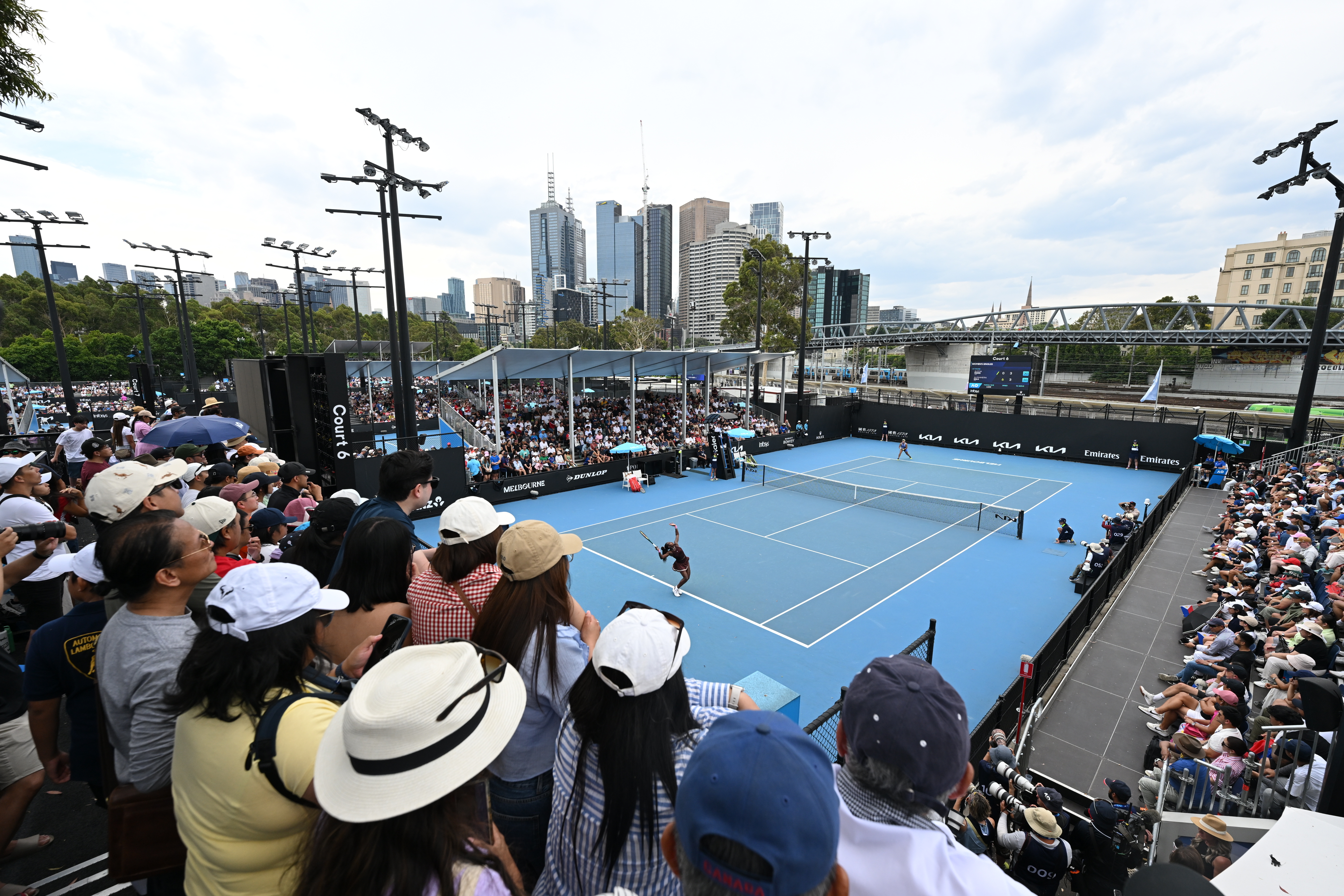 Spectators watching a tennis match on Court 6 at the Australian Open in Melbourne.
