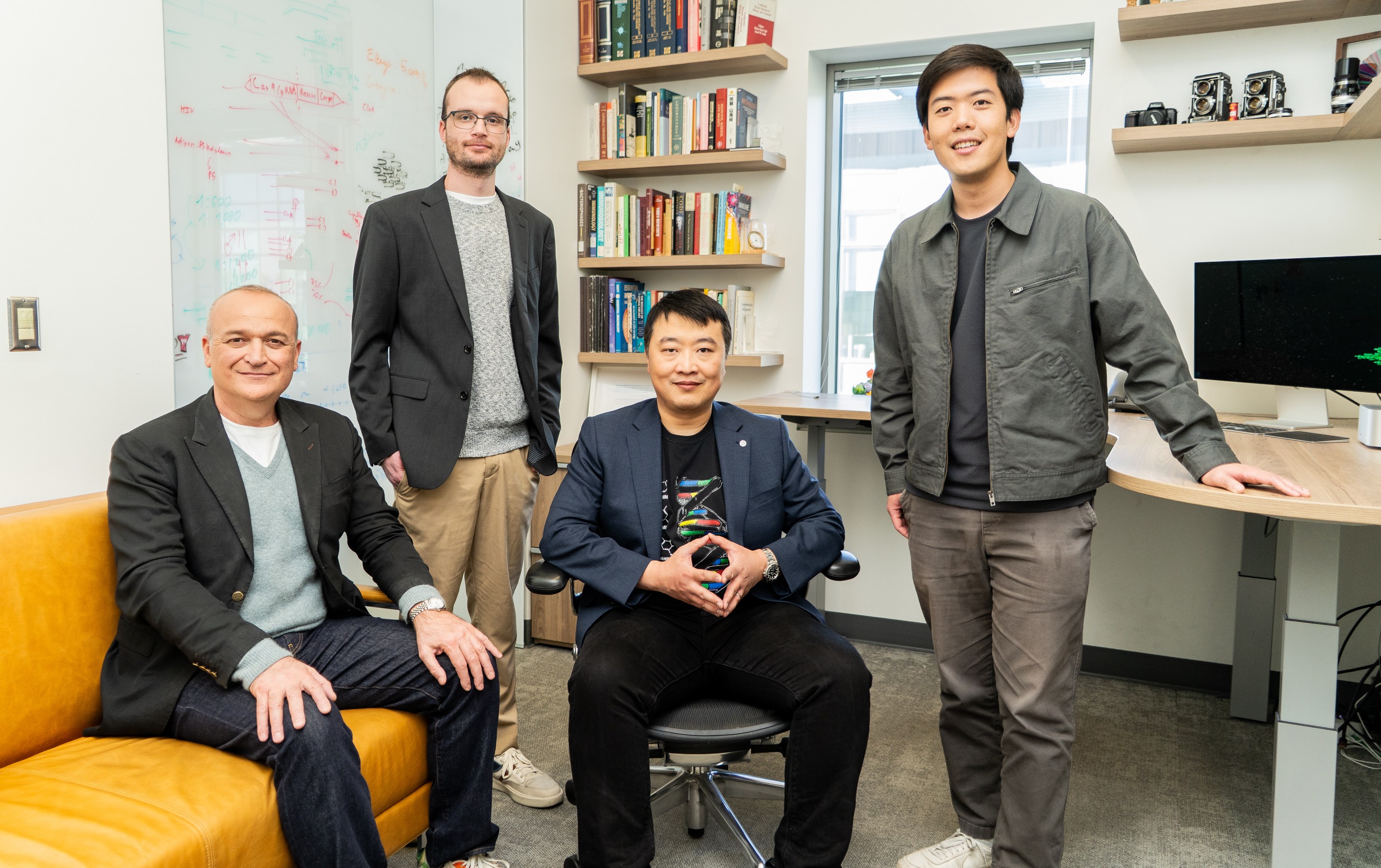 Portrait of Adrian Woolfson, Noah Robinson, Kaihang Wang, and Brian Hie, the scientific team working on writing genetic codes to create synthetic life.