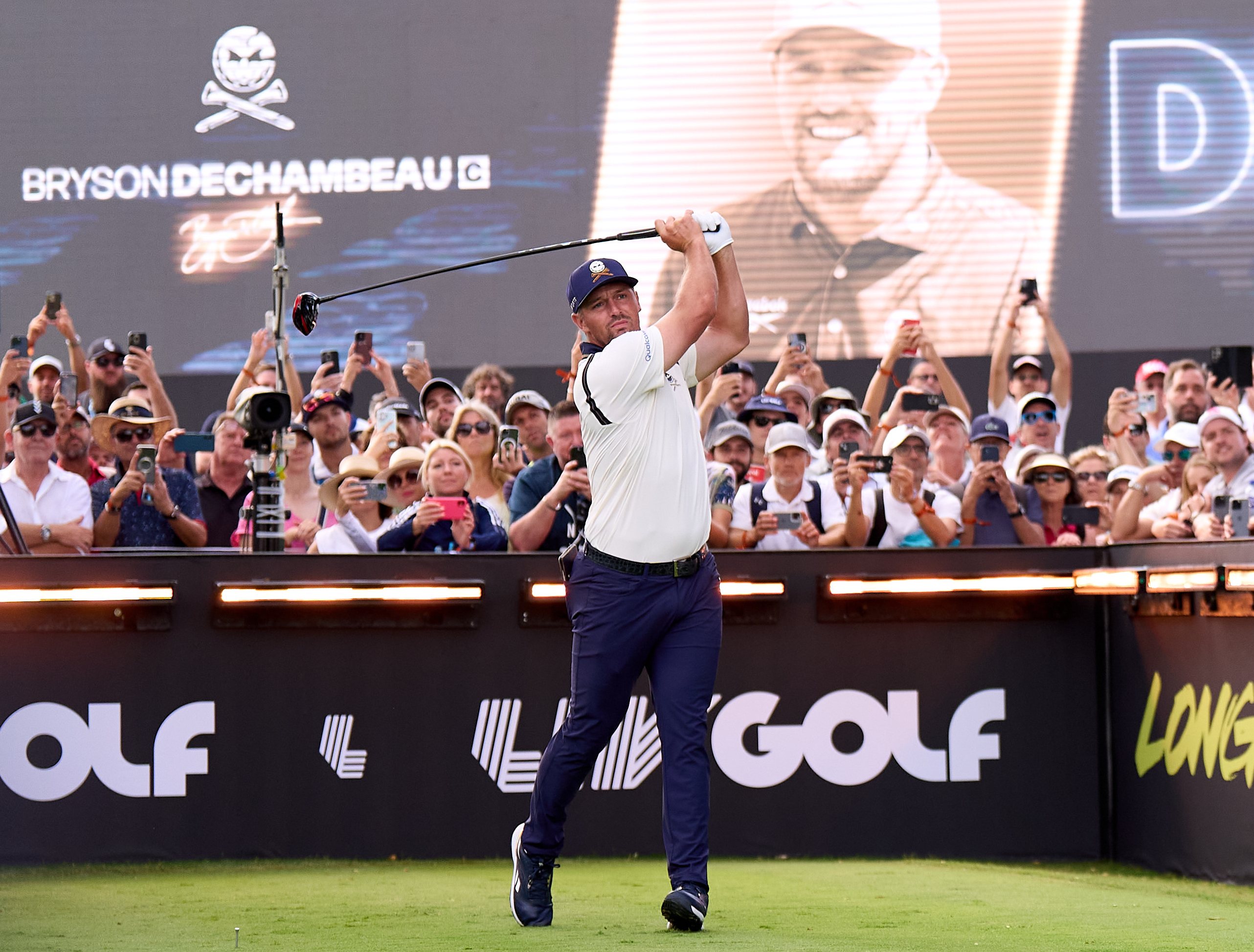 Bryson DeChambeau swinging a golf club on the first tee at LIV Golf Andalucia.
