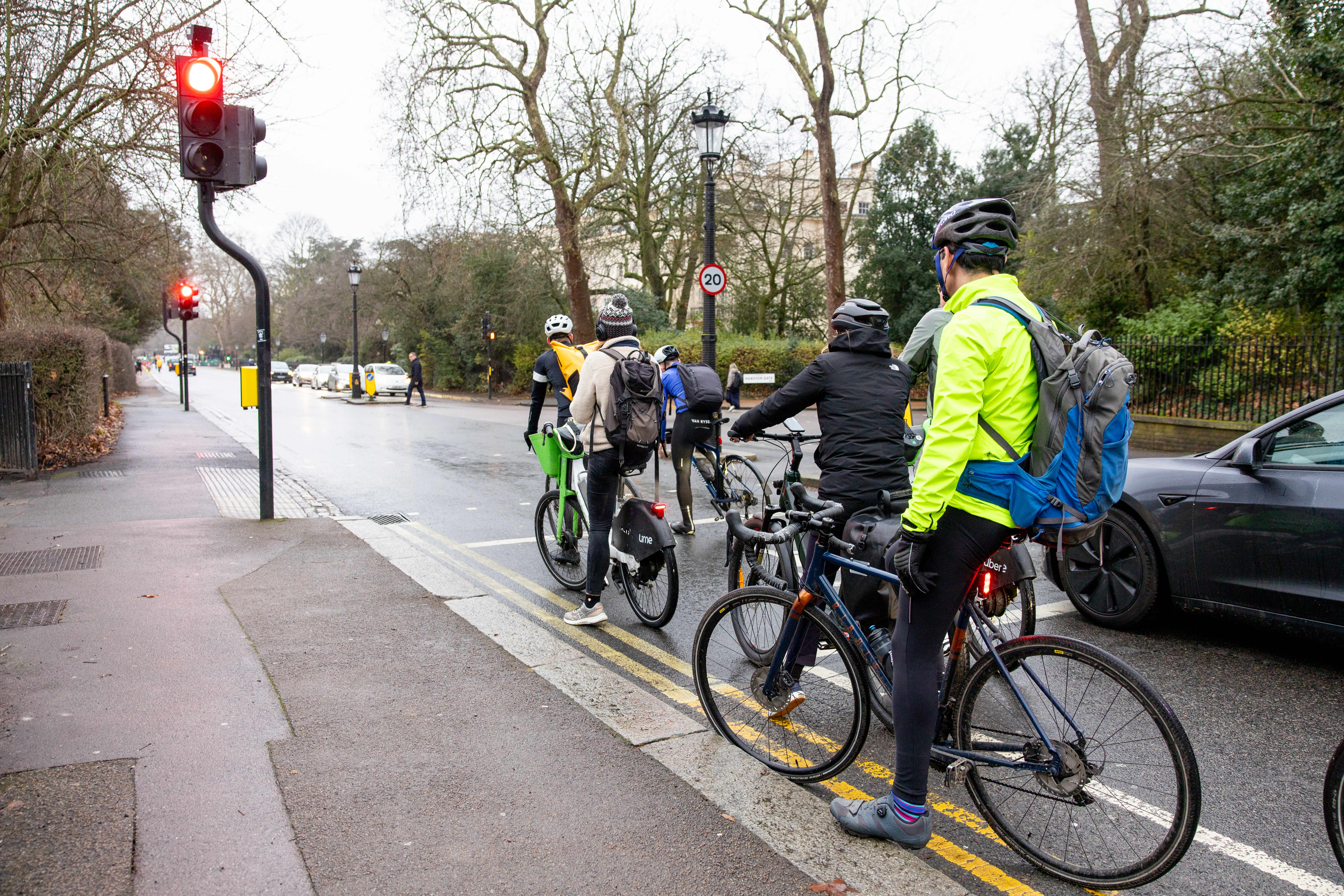 Cyclists wait for a red light in Regent's Park.