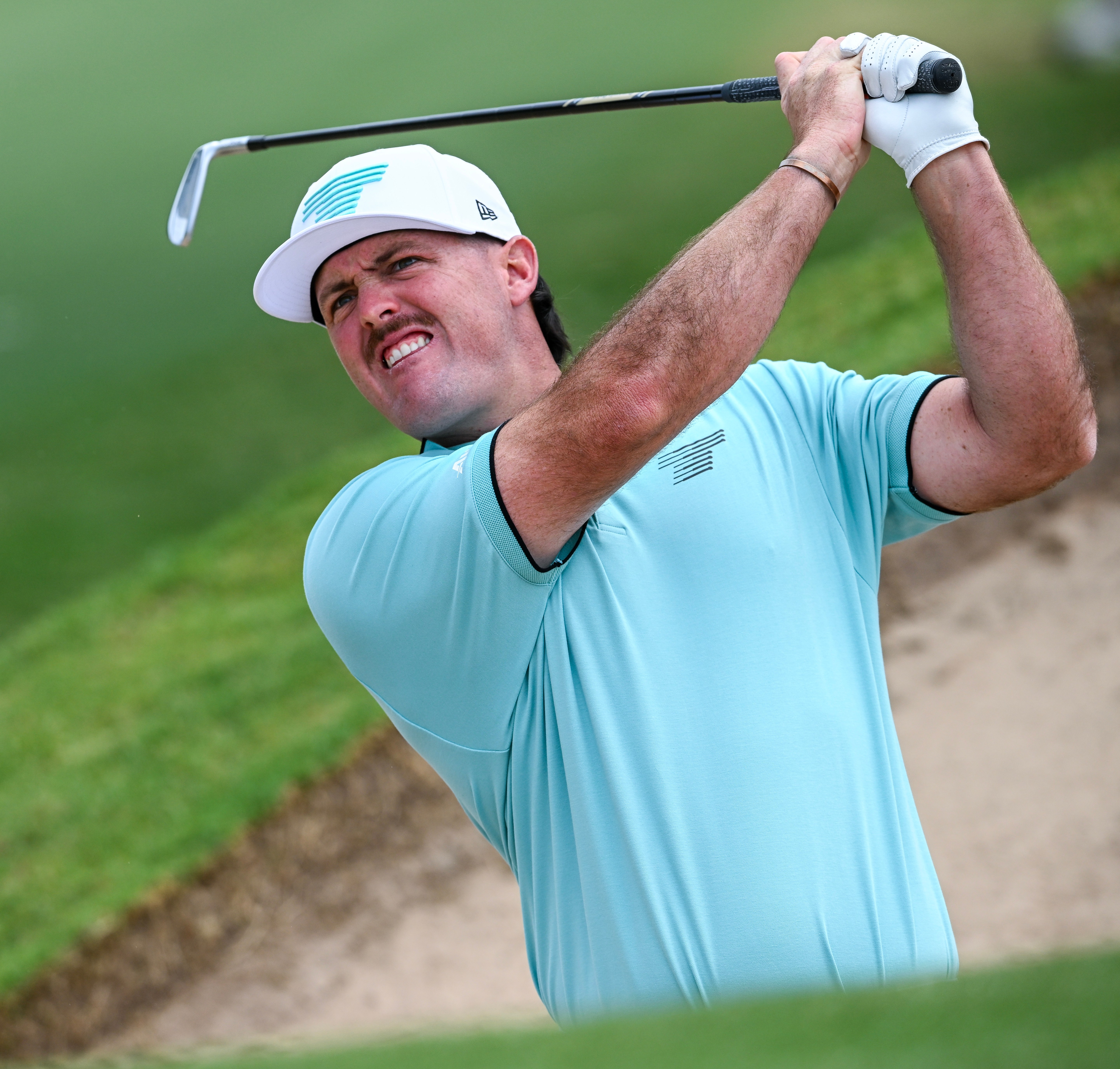 Mito Pereira hitting a golf ball out of the sand during LIV Golf Adelaide.