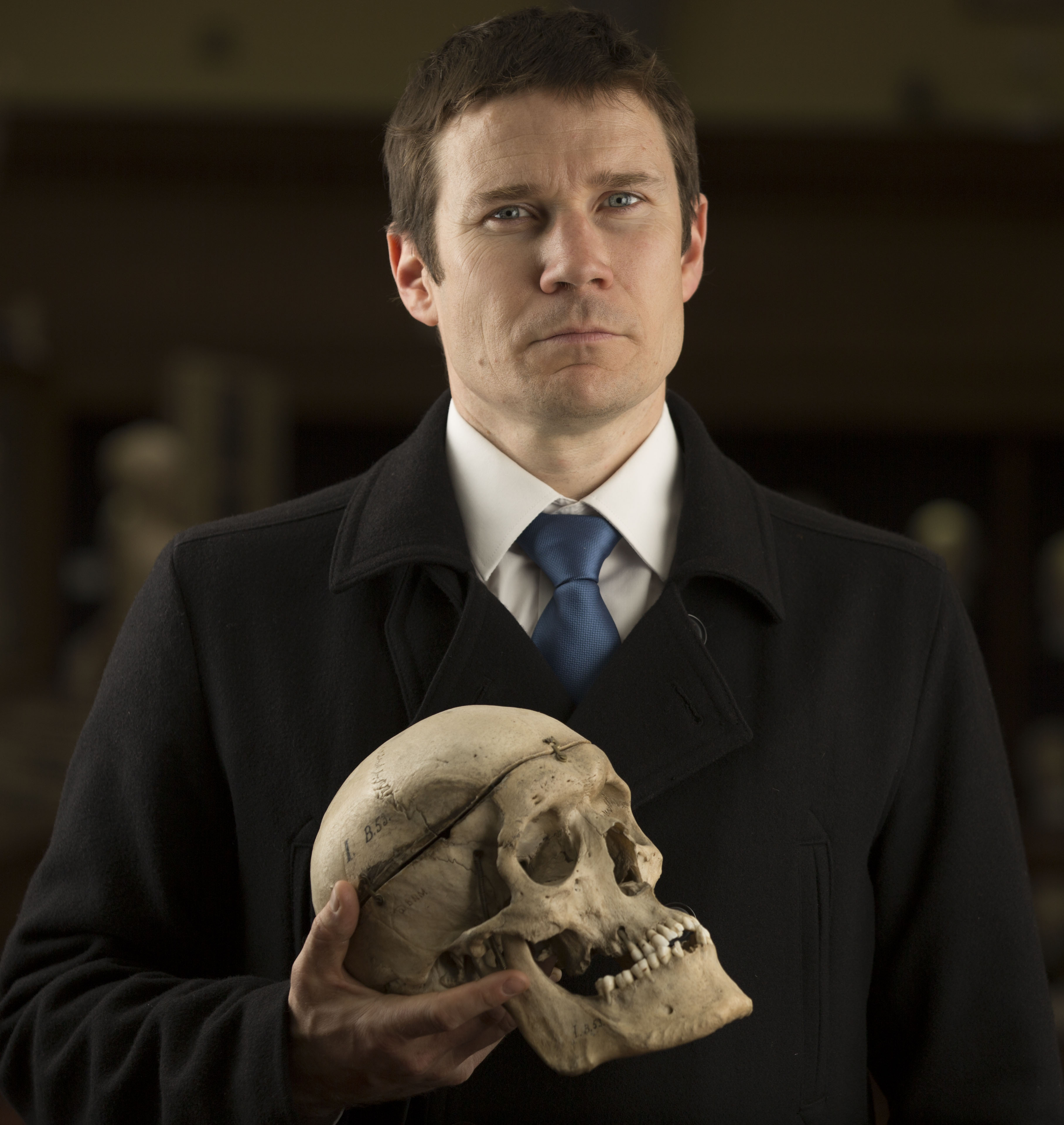 GP and writer Gavin Francis holding a human skull.
