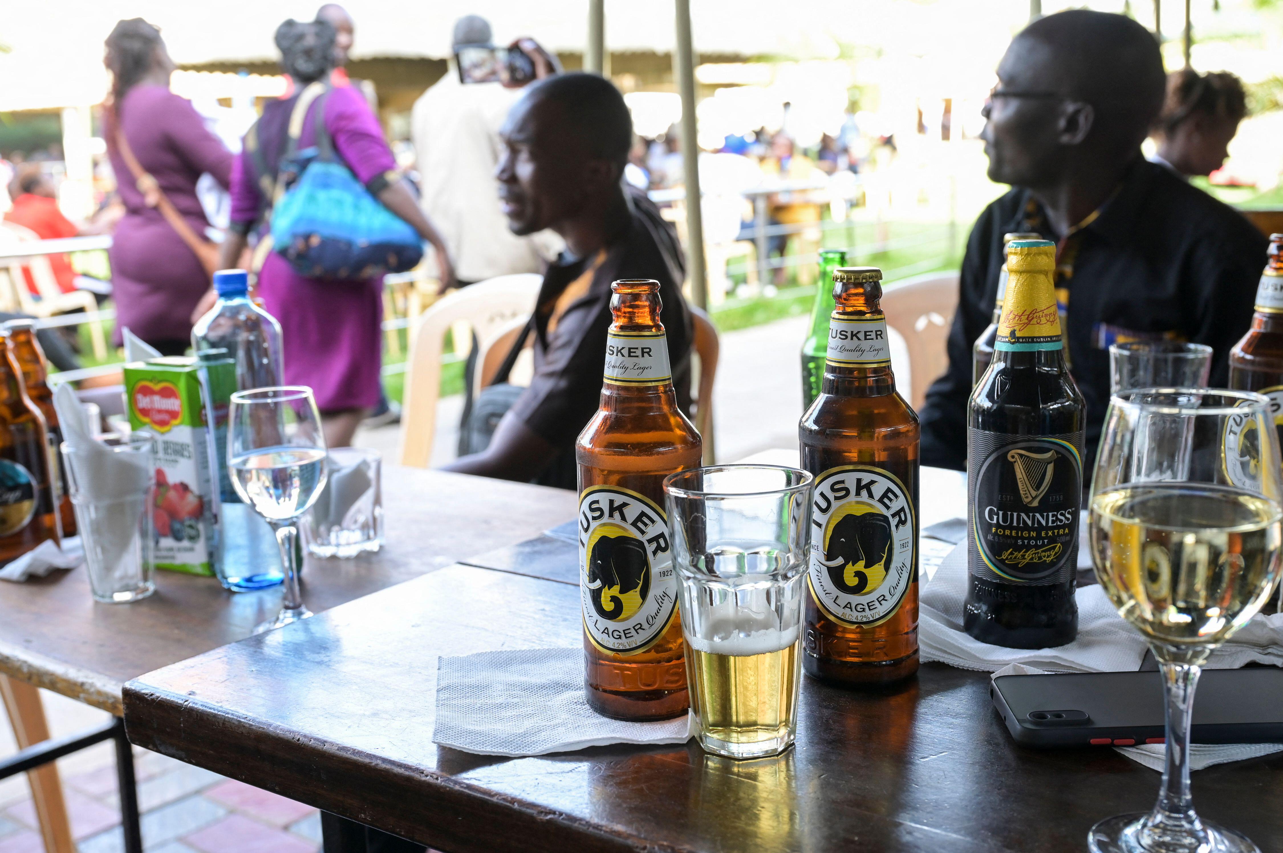 Middle-class individuals in Nairobi, Kenya, consuming Tusker lager and Guinness stout.