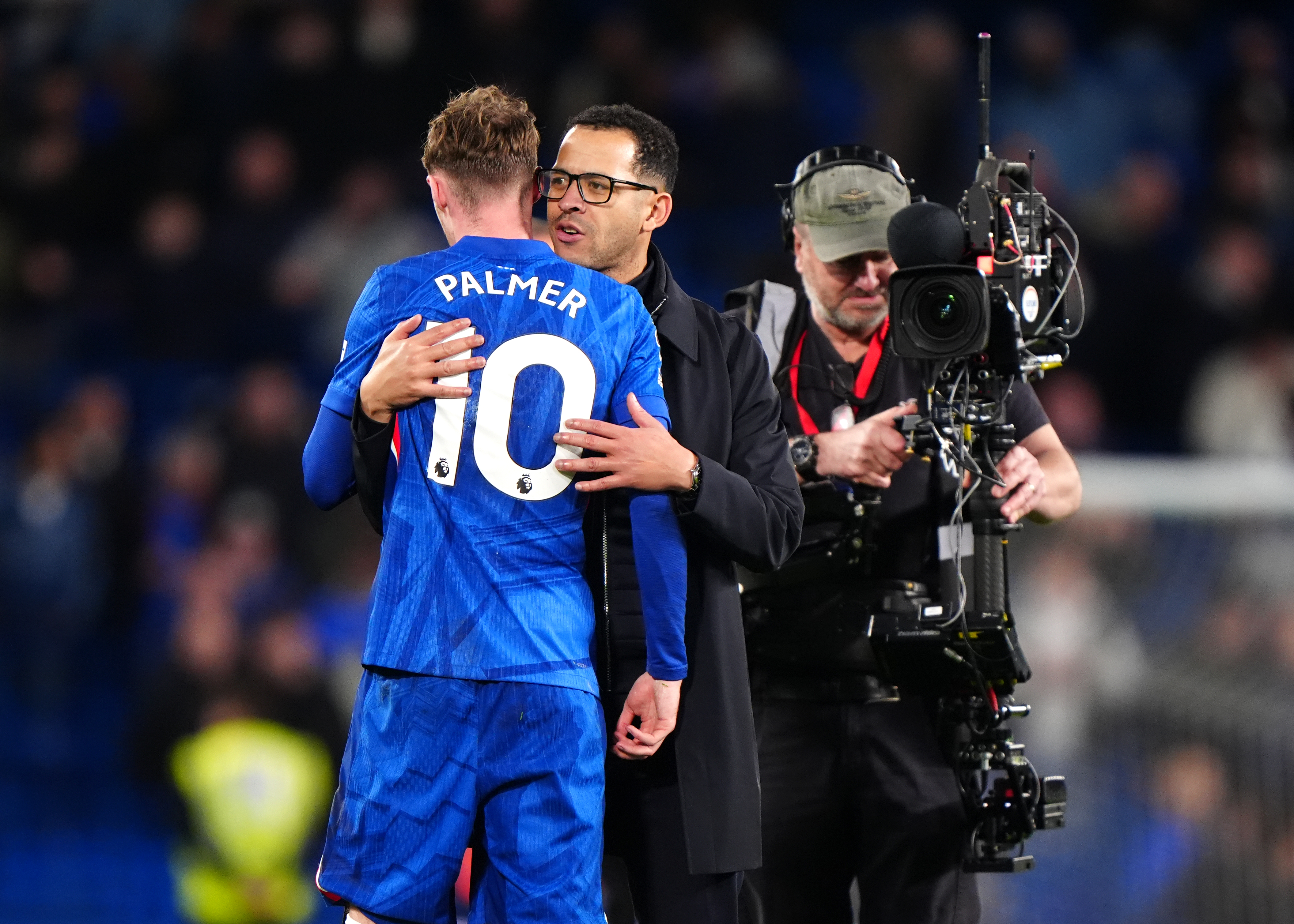 Chelsea's Cole Palmer embraces manager Liam Rosenior.