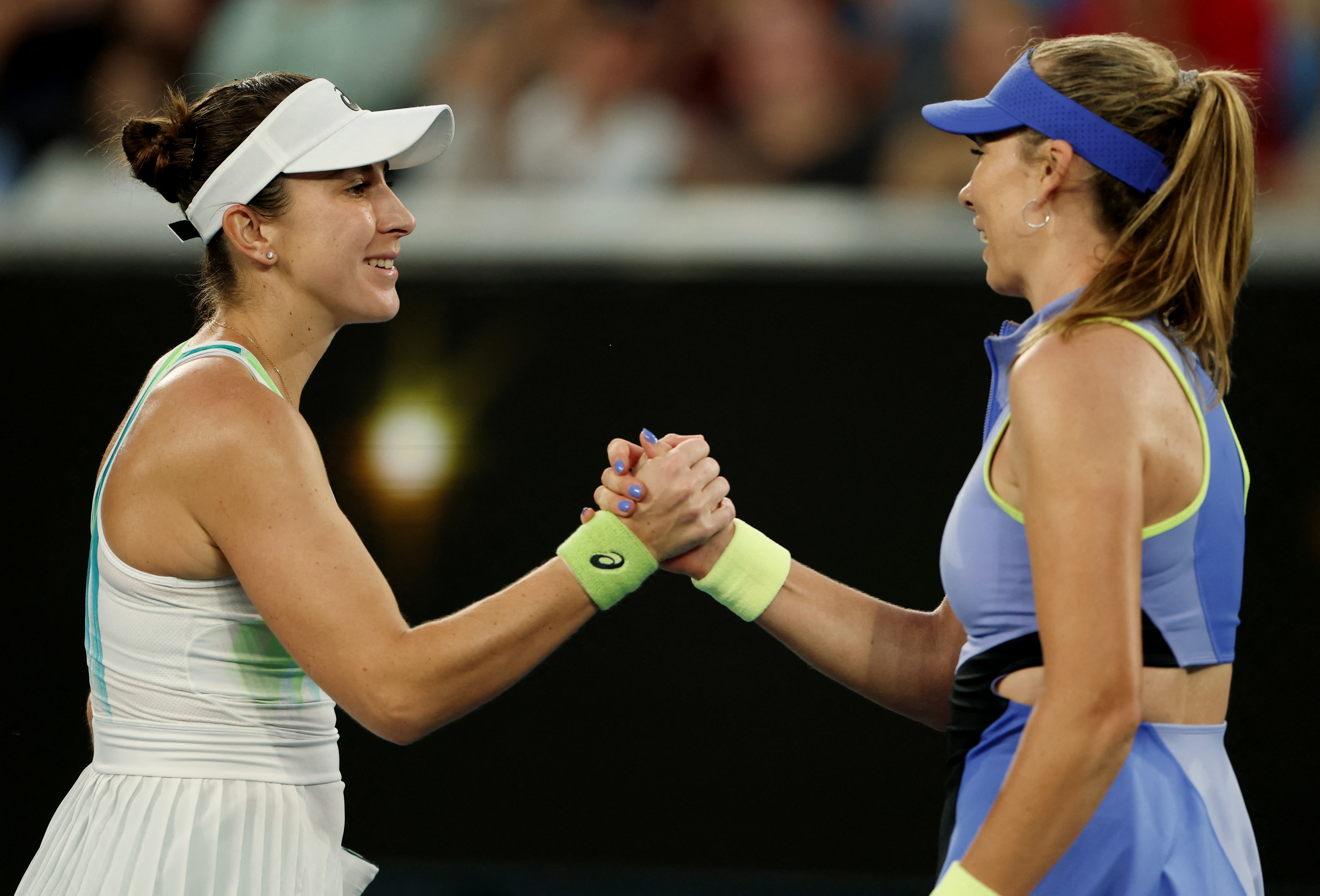 Belinda Bencic shakes hands with Katie Boulter after a match at the Australian Open.