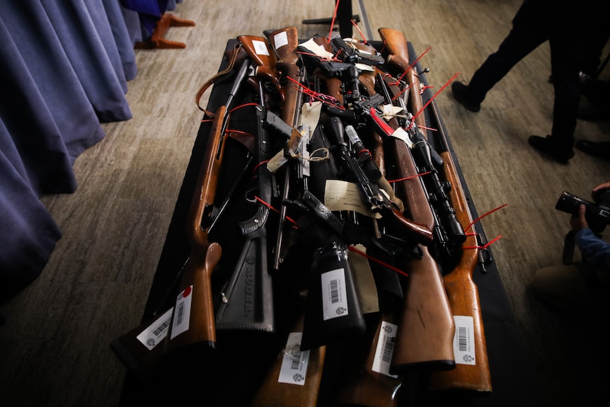 A collection of guns on display. 