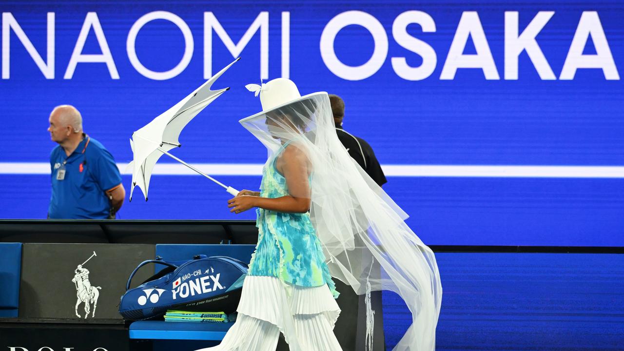 Naomi Osaka’s outfit before first-round match stuns tennis world, jellyfish dress, veil and umbrella, wins vs Antonia Ruzic, video, latest news