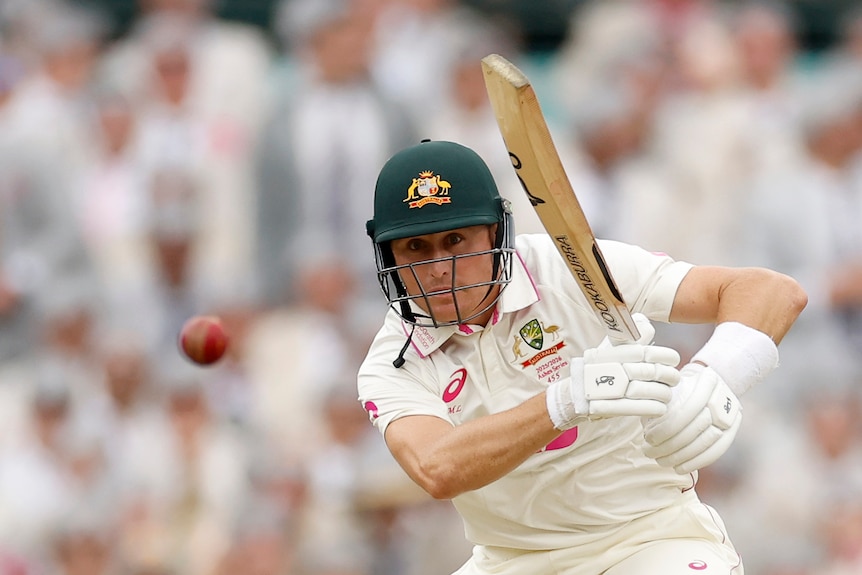 Australia batter Marnus Labuschagne watches the cricket ball after hitting a shot.