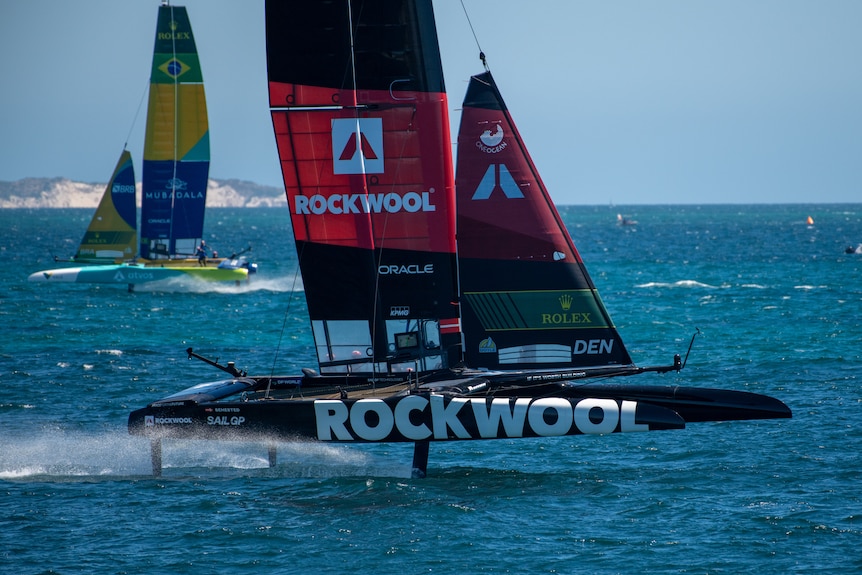 The Rockwool Racing ship sails on open water.