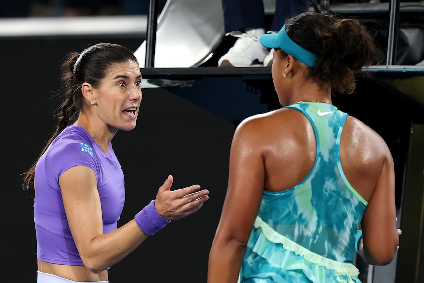 Sorana Cirstea gestures at Naomi Osaka