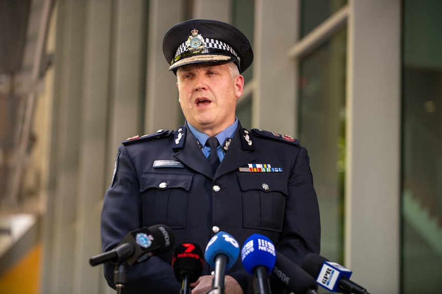 WA Police Commissioner Col Blanch speaks to reporters in full police uniform.