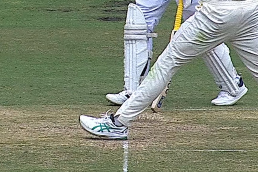 A cricket bowler bowls a front foot no ball