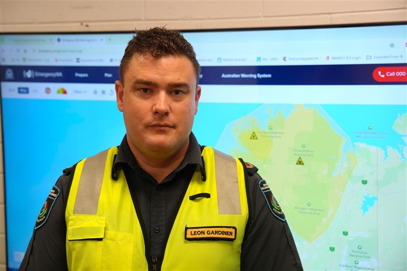 Man wearing high vis vest looking at camera