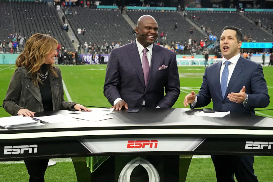 <p>ESPN personalities Suzy Kolber and Booger McFarland and Adam Schefter talk after the NFL Pro Bowl football game. Mandatory Credit: Kirby Lee-Imagn Images</p>