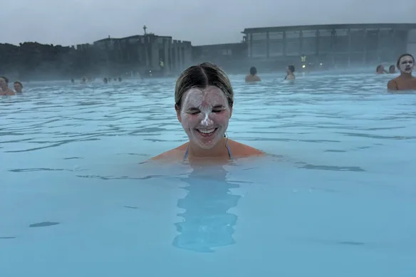 Katie Berridge takes a dip in the Blue Lagoon geothermal spa near Grindavik in Iceland, August 2025.