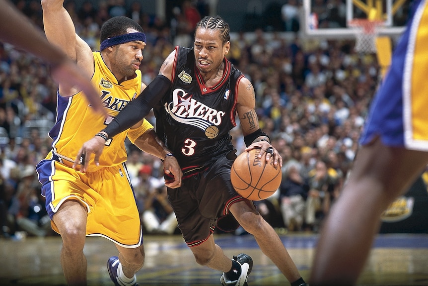 Allen Iverson dribbles the ball against the LA Lakers during the NBA finals in 2001.