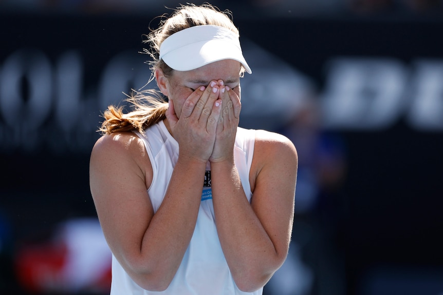 Maddison Inglis holds her face as she celebrates a win at the Australian Open.