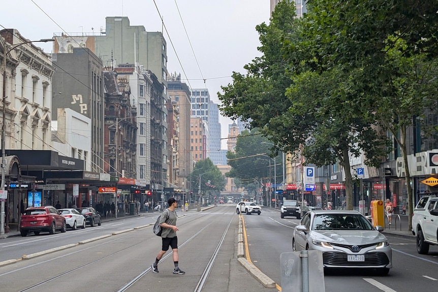 A man crossing the road in the CBD