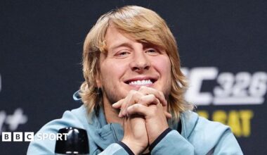 Paddy Pimblett grins during a news conference