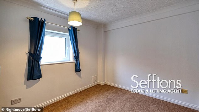 The same room with no furniture inside, as seen in a previous listing, which suggests the lighting may be a little more subdued