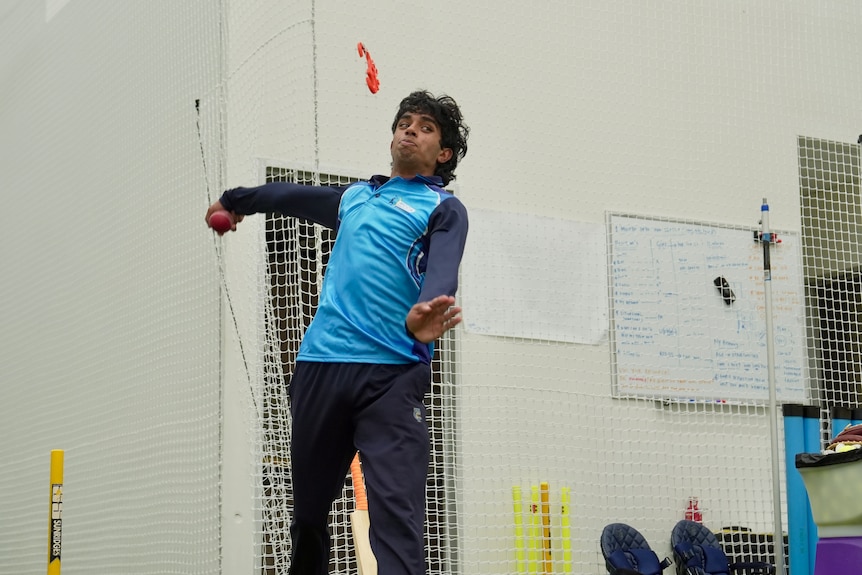 Paawan Singh bowling spin.