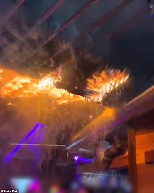 A dramatic video captured the moment the ceiling of a Swiss ski bar caught fire