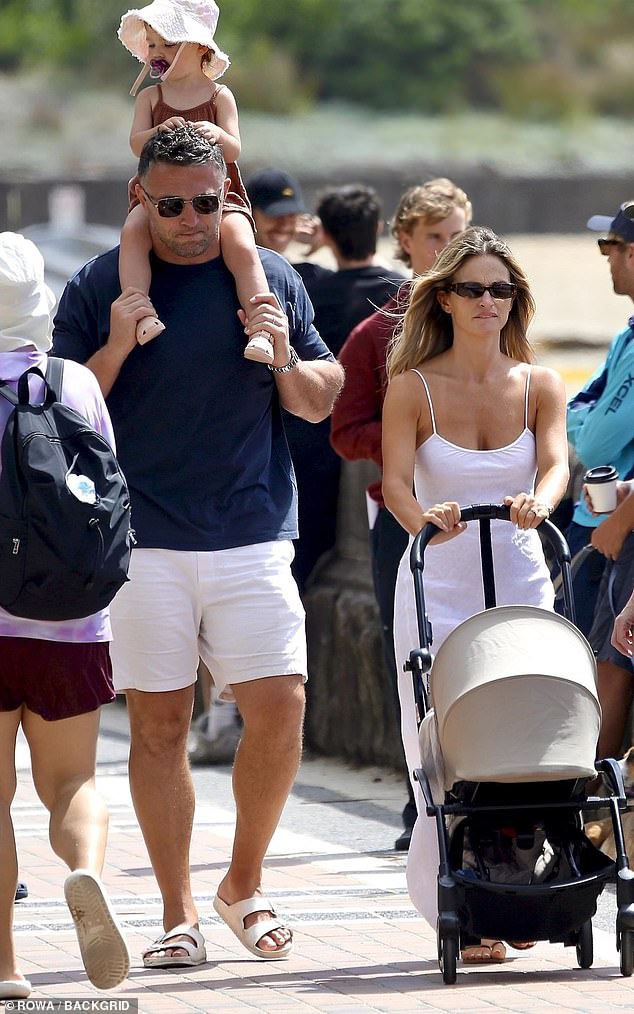 Lucy, 33, showcased her post-baby body in a white linen dress as the family enjoyed the sunny day out