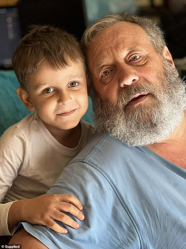 Mr Jackson initially became unwell with what seemed like a small sniffle (pictured with his grandson)