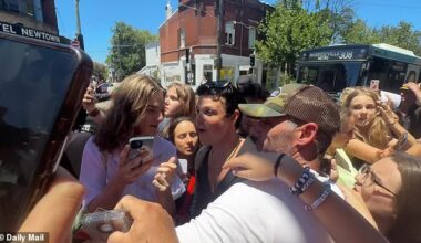 Police were forced to disperse crowds attending an exhibition in Sydney on Thursday after a visiting rock star was mobbed by hundreds of fans