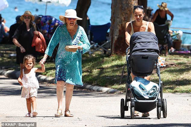 Their two daughters, Marlie and Rosie (left), were also spotted alongside another family member