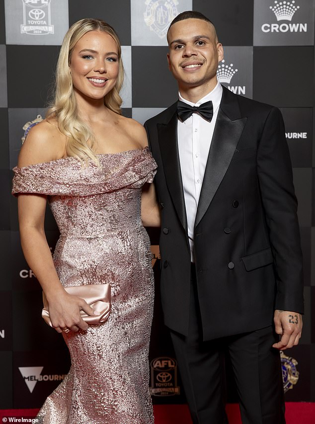 Bobby Hill has not returned to Collingwood for pre-season training and is now on a leave of absence (pictured, with former partner Georgia Devlin)