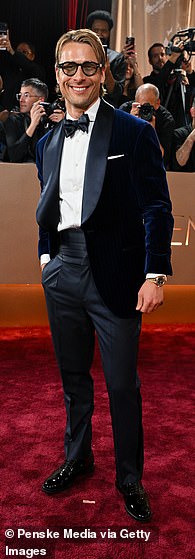 Glen Powell rocked a blue velvet blazer