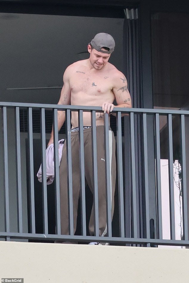 He may be weathering a scandal, but AFL star Lachie Neale showed no sign of strain as he checked out the balcony of his new Brisbane bachelor pad last Thursday