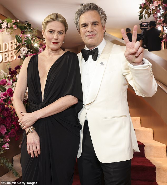 Mark Ruffalo and other A-listers honored the memory of Renee Good and protested the US Immigration and Customs Enforcement (ICE) agency on the red carpet of the 83rd Golden Globes on Sunday; pictured with his wife Sunrise Coigney