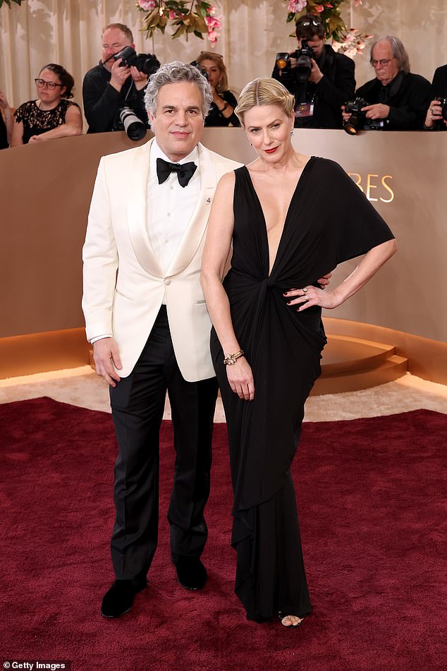 Ruffalo wore a 'Be Good' pin on the lapel of his white tux jacket. The campaign also honors Keith Porter, who was shot and killed by an off-duty ICE agent on New Year's Eve