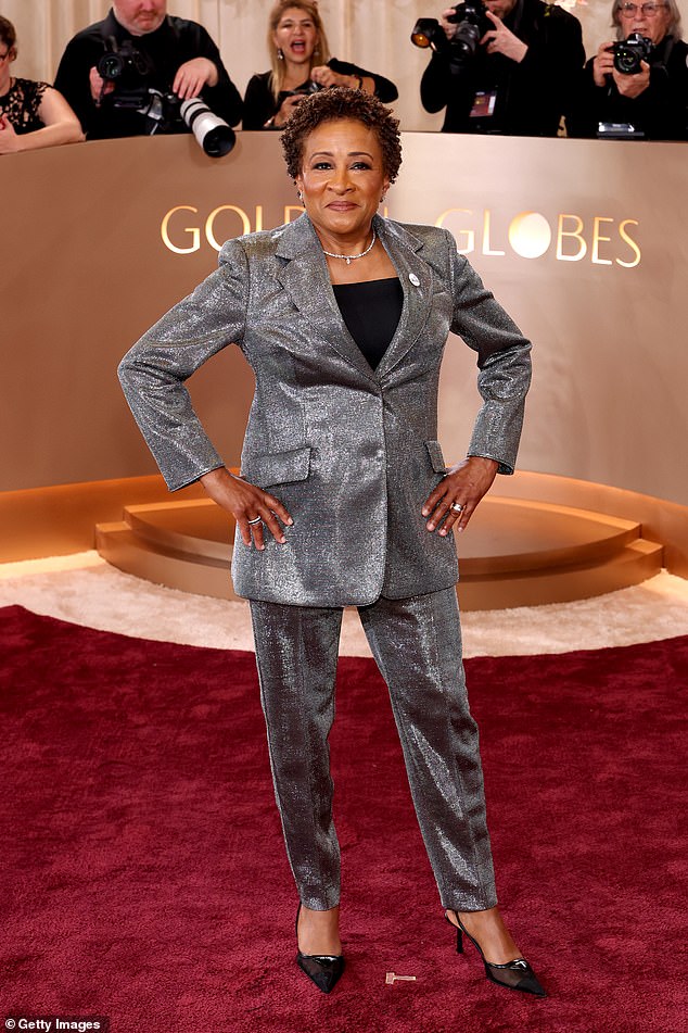 Wanda Sykes wore a 'Be Good' pin on her silver¿gray suit's lapel