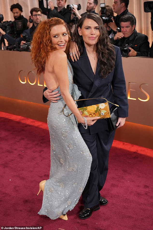 Lyonne flashed her 'Be Good' button her Valentino clutch while walking the red carpet with her longtime friend and costar Clea DuVall