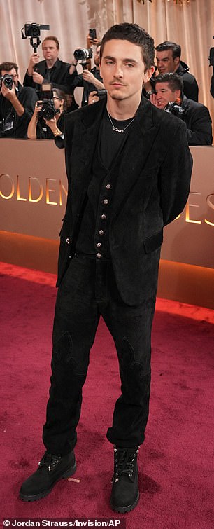 She did not walk the red carpet with her beau, who chose to pose solo instead