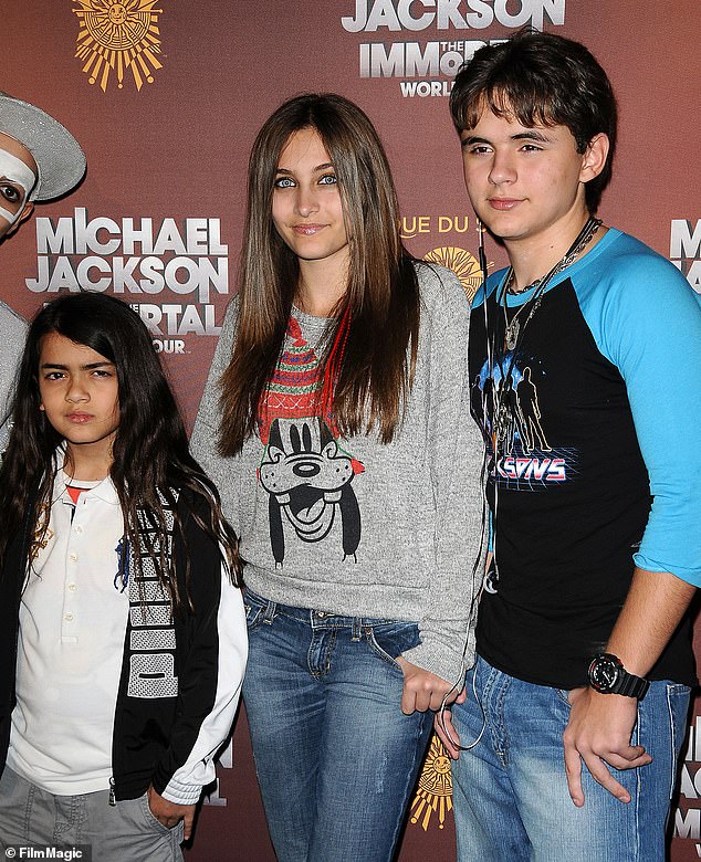 Bigi Jackson, left, with his elder siblings Paris, centre, and Prince in 2012