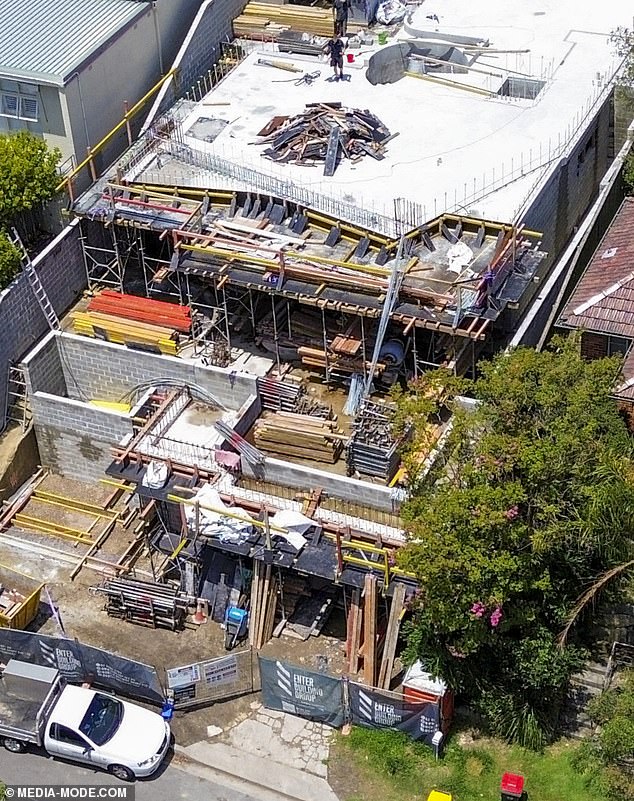 Photos captured this week show what was once a 1960s brick house slowly transforming into a dramatic three-storey abode