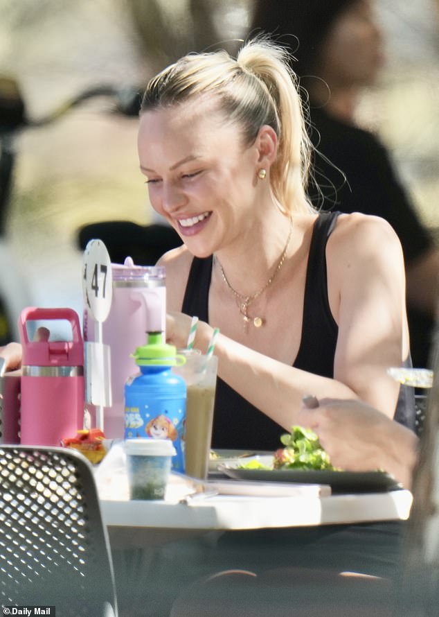 Beaming as she tucked into her meal, she looked worlds away from the teary-eyed woman seen last month in Brisbane as she stopped by a cafe while packing up her former marital home