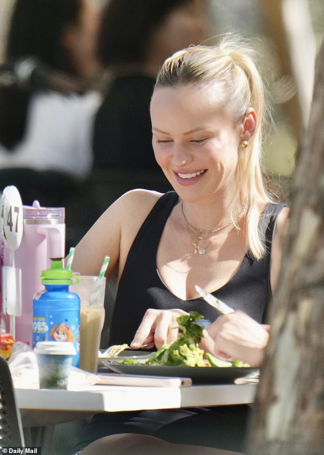 The former WAG, 35, who recently relocated to Western Australia with her two children amid the shock split, was spotted for the first time since her move to Perth on Friday, looking relaxed as she chatted and laughed with friends at an outdoor venue