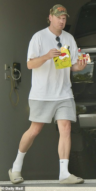 Ben (pictured on December 21) said 'she does not live here anymore' when I knocked on his door to ask about his wife Tess on Sunday afternoon