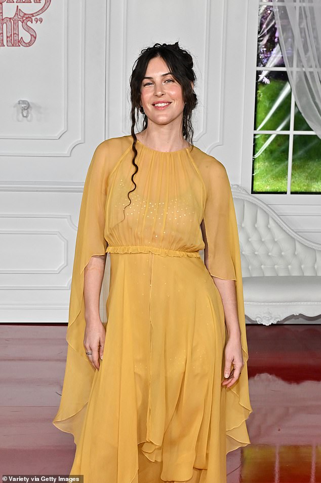 Bruce Willis and Demi Moore's daughter Scout Willis, 34, flashed a sweet smile as she hit the red carpet in a flowing yellow number