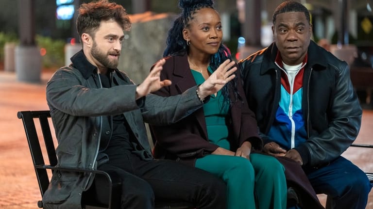 Daniel Radcliffe, left, as Arthur Tobin, Erika Alexander as Monica...